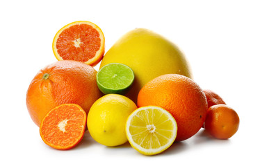Mixed citrus fruit including lemon, limes, grapefruit, pomelo, orange and tangerine isolated on a white background, close up