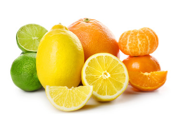 Obraz na płótnie Canvas Mixed citrus fruit including lemons, grapefruit, tangerines and limes isolated on a white background, close up