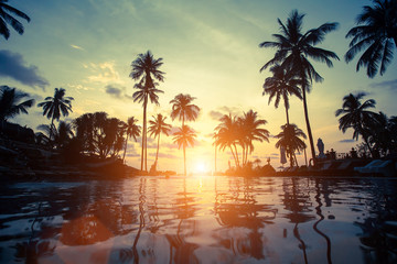 Naklejka na ściany i meble Beautiful sunset at a beach in tropics.