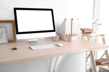 Stylish workplace with computer at home