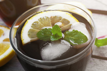Glass of cola with ice, close up