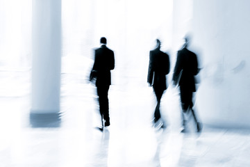 group of people in the lobby business center and blue tonality