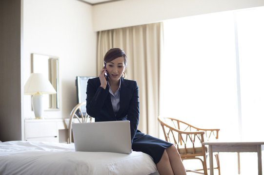 Women are on the phone in the hotel business trip destination