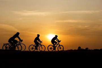 Wall murals Bicycles Silhouette of cycling on sunset background