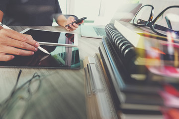 business documents on office table with smart phone and digital