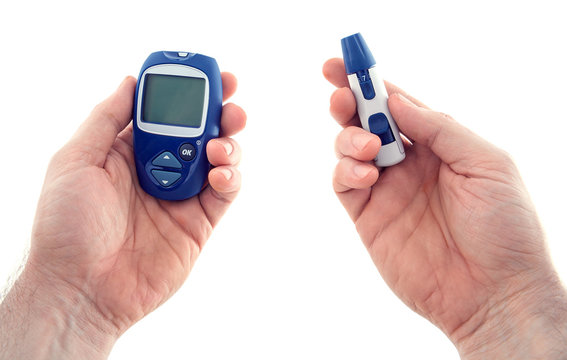 Glucometer and the lancing device  in hands