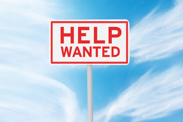 Signpost with text of Help Wanted