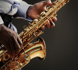 Obraz premium African American jazz musician playing the saxophone, closeup