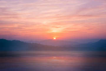 Fototapeta premium Colorful sunset on top of thailand mountain and lagoon. Vintage