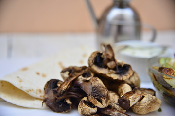 Roasted mushroom, leek and taco wrap with yogurt sauce