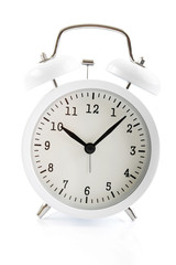 White alarm clock shows 7 after 10