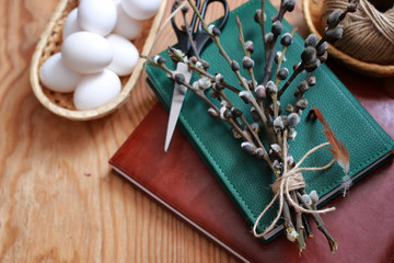 willow and egg on a wooden background