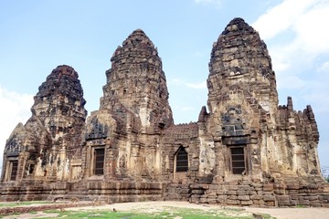 Fototapeta na wymiar Phra Prang Sam Yod ,Lopburi, Thailand. The compound comprises three prangs linked to one another. It was made of laterite and decorated with beautiful stucco relief, Bayon style of Khmer art.