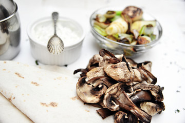 Roasted mushroom, leek and taco wrap with yogurt sauce