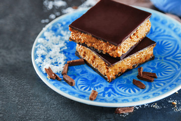 Tasty homemade cakes with chocolate on dark background, close up