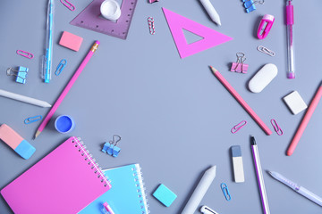 Set of stationery on grey table, top view