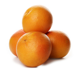 Pile of grapefruits isolated on white background