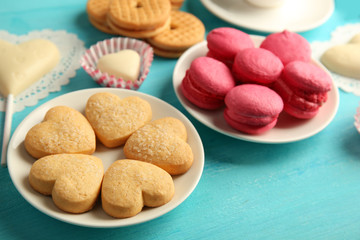 Valentine concept. Composition of cookies and candies on blue background