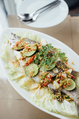 Thai food fish sour spicy on the dish