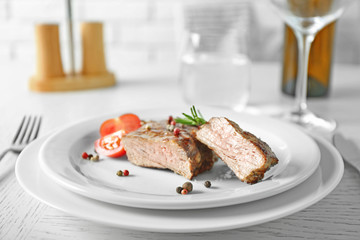 Delicious grilled steak on plate with white wine