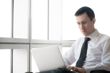 Fototapeta premium Businessman focusing on work
