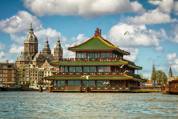 Historical church and famous floating Chinese restaurant in Amsterdam
