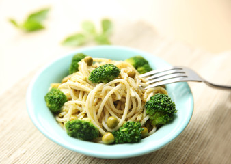 Delicious cold pasta salad in bowl on the table closeup
