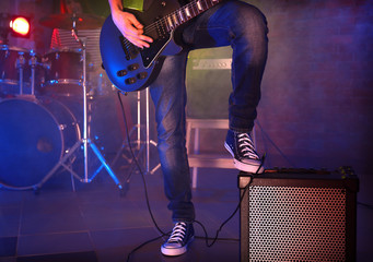 Musician's foot stepped on amplifier