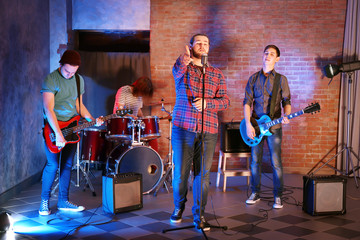 Music band performing on stage.