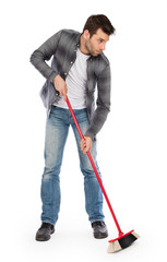 Young worker with a broom
