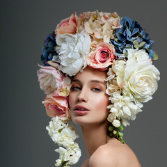 Obraz premium Beautiful woman with flowers in her hair. Bouquet of Beautiful F