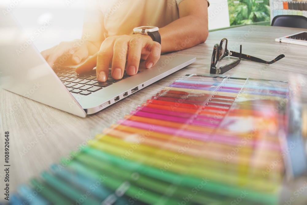 Poster website designer working digital tablet and computer laptop with
