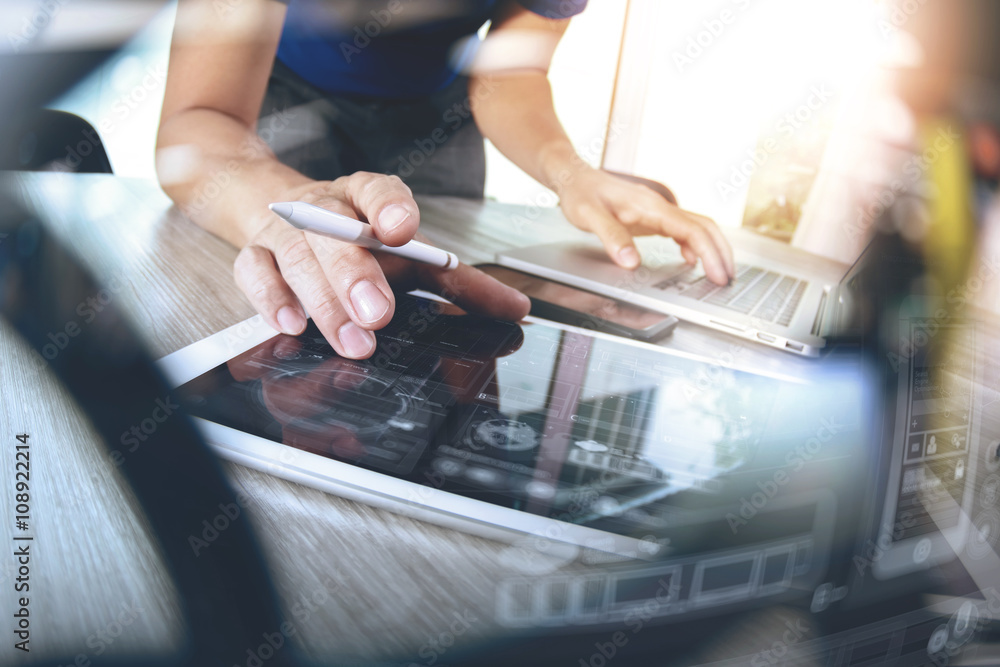 Poster website designer working digital tablet and computer laptop with