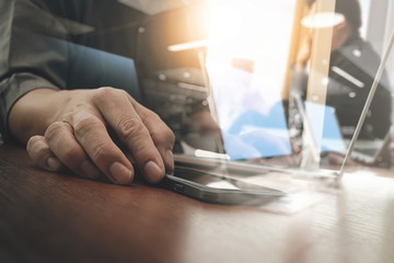 business man hand working on digital tablet computer and smart p