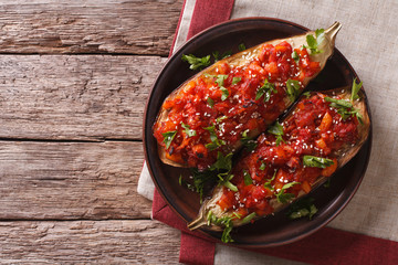 Imam bayildi with vegetables and sesame close-up. horizontal top view 
