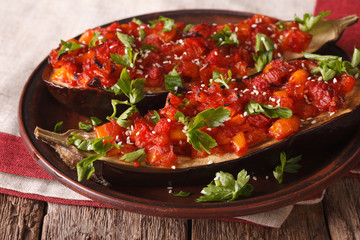 Turkish Cuisine: Half of eggplant stuffed with vegetables close-up. horizontal

