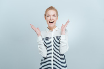 Fototapeta premium Cheerful woman with mouth open looking at camera