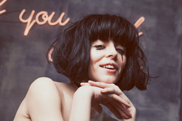 The tear-stained girl with the begun to flow ink, smiling