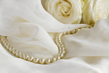 Wedding background with pearl beads and roses