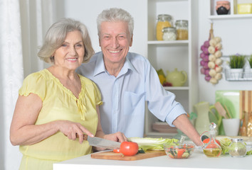 senior man and woman  in the kitchen