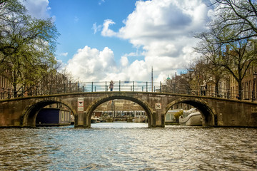 Fototapeta na wymiar Bridge over canal in Amsterdam, the Netherlands
