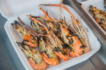 Grilled shrimps on foam box for lunch