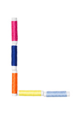 L letter made of spool sewing thread