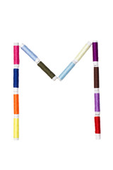 M letter made of spool sewing thread