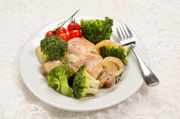 chicken breast filet on an oval dish with vegetable
