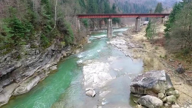 beautiful landscape with river and bridge in Carpathians