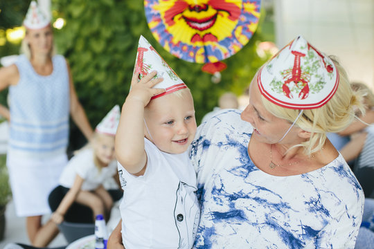 Mother with son in party hats