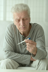 mature man with thermometer