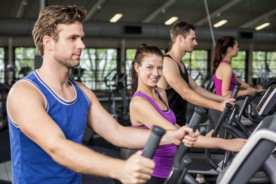 Fit People On Elliptical Bike