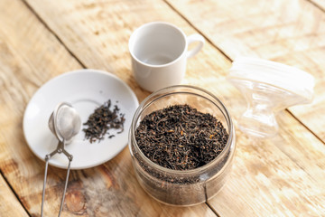 Tea set on the wooden table at sunny morning